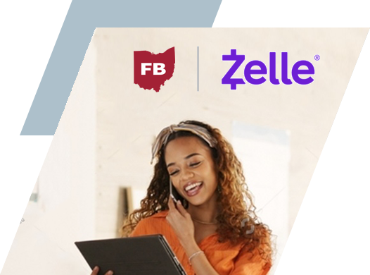 Woman business owner on iPad receiving payment through Zelle. FBCO Zelle partnership logo above her head.