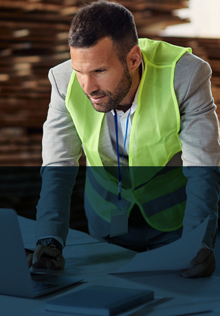 Residential builder reviewing plans on jobsite.